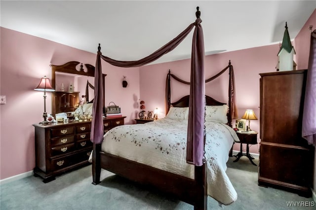 carpeted bedroom with baseboards