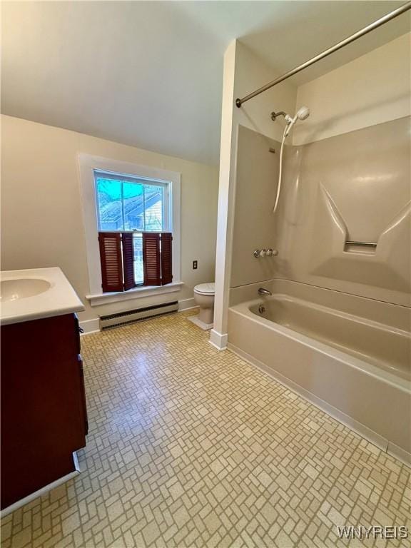 bathroom featuring a baseboard radiator, toilet, brick patterned floor, shower / washtub combination, and vanity