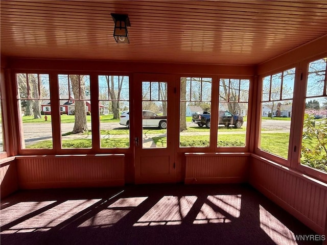 unfurnished sunroom featuring a wealth of natural light