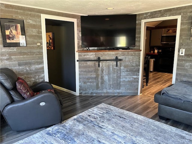 living area with wood finished floors and baseboards