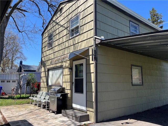 view of home's exterior with an outdoor structure