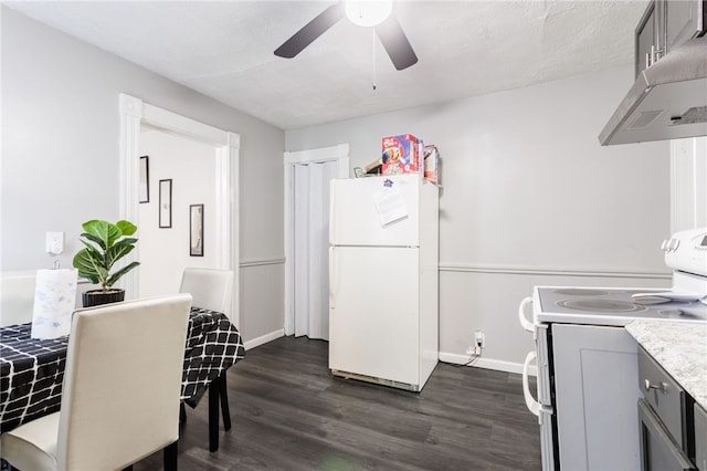 kitchen with light countertops, dark wood-style floors, under cabinet range hood, white appliances, and a ceiling fan