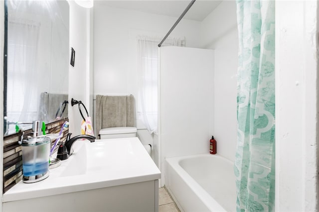 bathroom featuring tile patterned floors, shower / tub combo with curtain, and vanity