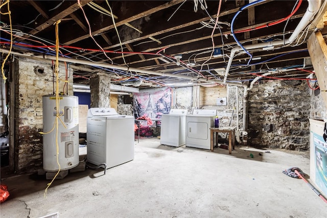 unfinished below grade area with water heater and washing machine and clothes dryer