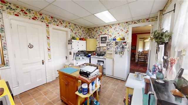 20 S Main St, Sherburne, NY 13460 - kitchen featuring light tile patterned flooring, a drop ceiling, white appliances, and wallpapered walls