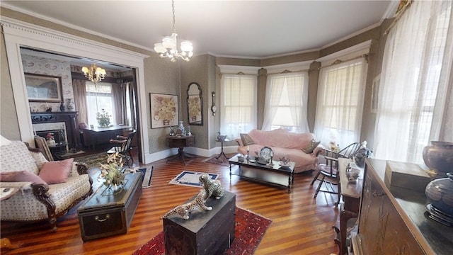 20 S Main St, Sherburne, NY 13460 - living area featuring an inviting chandelier, a fireplace, baseboards, ornamental molding, and wood finished floors
