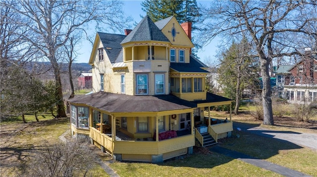 20 S Main St, Sherburne, NY 13460 - back of property with roof with shingles, a chimney, and a porch