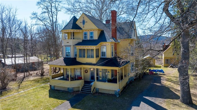 20 S Main St, Sherburne, NY 13460 - view of front of house with a front yard, a chimney, a porch, and stairway