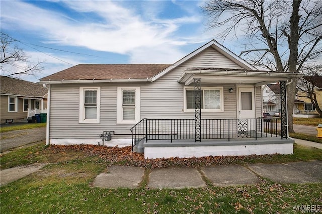 1001 Garden Ave, Niagara Falls, NY 14305 - view of front facade featuring roof with shingles and covered porch