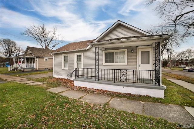 1001 Garden Ave, Niagara Falls, NY 14305 - view of front of home with a front lawn and covered porch