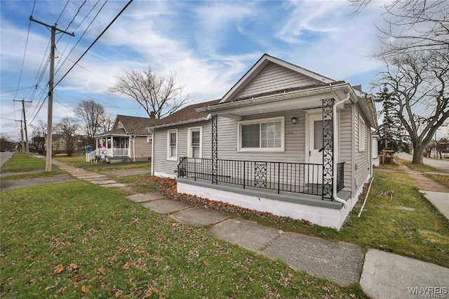 1001 Garden Ave, Niagara Falls, NY 14305 - view of front of home featuring a porch and a front lawn