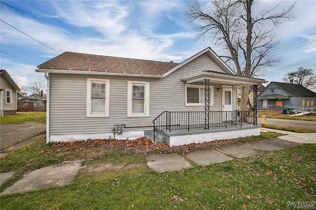 1001 Garden Ave, Niagara Falls, NY 14305 - bungalow with a porch and roof with shingles