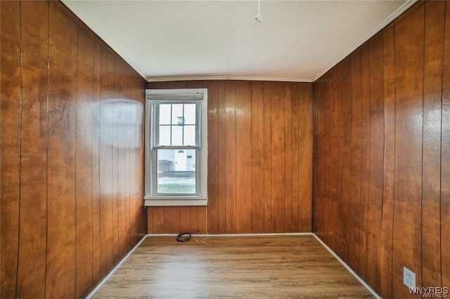 1001 Garden Ave, Niagara Falls, NY 14305 - unfurnished room featuring wooden walls, wood finished floors, and ornamental molding