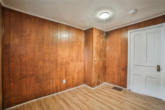 1001 Garden Ave, Niagara Falls, NY 14305 - unfurnished room featuring wooden walls, wood finished floors, and crown molding