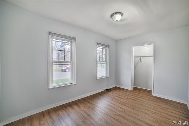 1001 Garden Ave, Niagara Falls, NY 14305 - unfurnished bedroom featuring baseboards, wood finished floors, and a closet