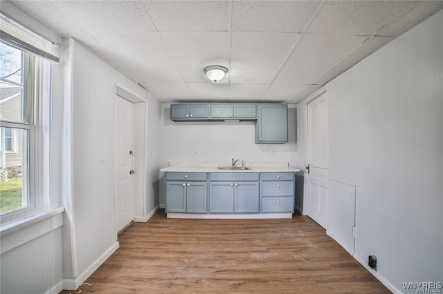 1001 Garden Ave, Niagara Falls, NY 14305 - interior space featuring wood finished floors, plenty of natural light, a paneled ceiling, and a sink