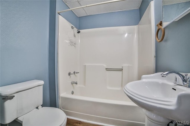 1001 Garden Ave, Niagara Falls, NY 14305 - full bath with toilet, a sink, washtub / shower combination, and wood finished floors