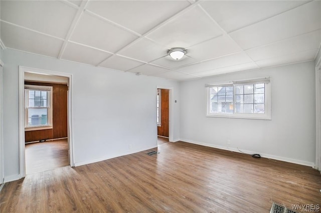 1001 Garden Ave, Niagara Falls, NY 14305 - spare room with baseboards, visible vents, wood finished floors, and plenty of natural light