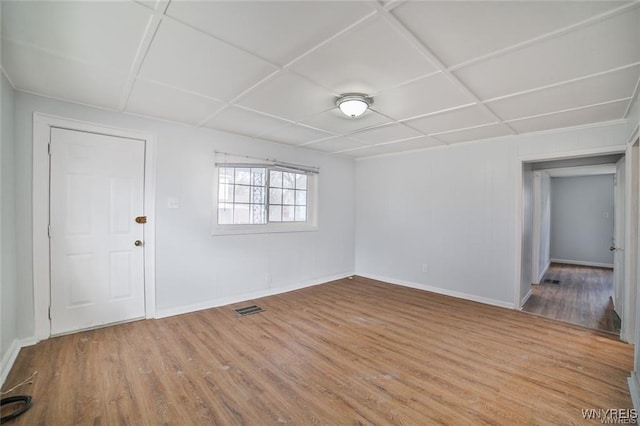 1001 Garden Ave, Niagara Falls, NY 14305 - interior space featuring wood finished floors, visible vents, coffered ceiling, and baseboards