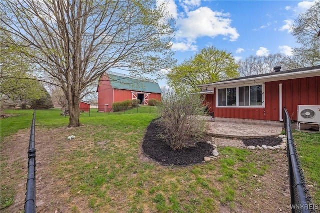 view of yard with ac unit and fence
