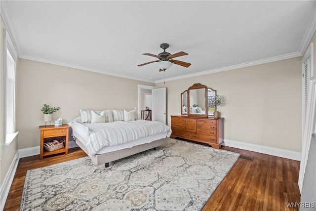 bedroom featuring ornamental molding, ceiling fan, baseboards, and dark wood finished floors