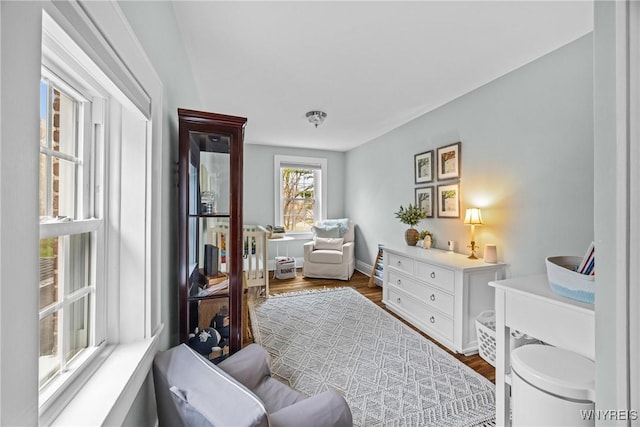 sitting room featuring dark wood finished floors