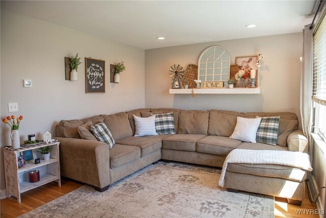 living area with recessed lighting and wood finished floors