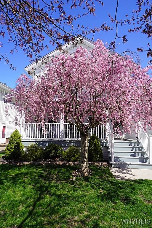 exterior space with a yard and stairway