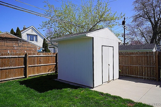 view of shed with a fenced backyard