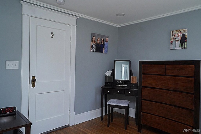 interior space with crown molding, baseboards, and dark wood finished floors