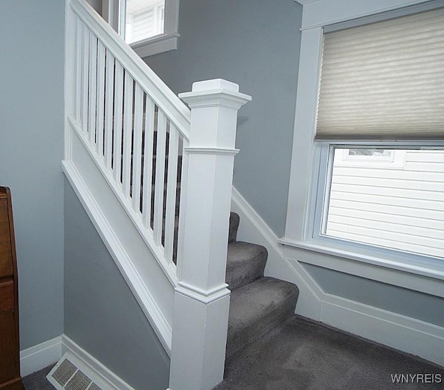 stairs featuring carpet floors and visible vents