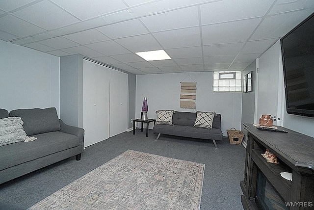 living room with carpet flooring and a drop ceiling