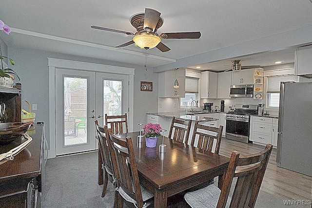 dining space featuring french doors, a ceiling fan, and recessed lighting