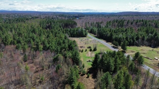 aerial view featuring a view of trees