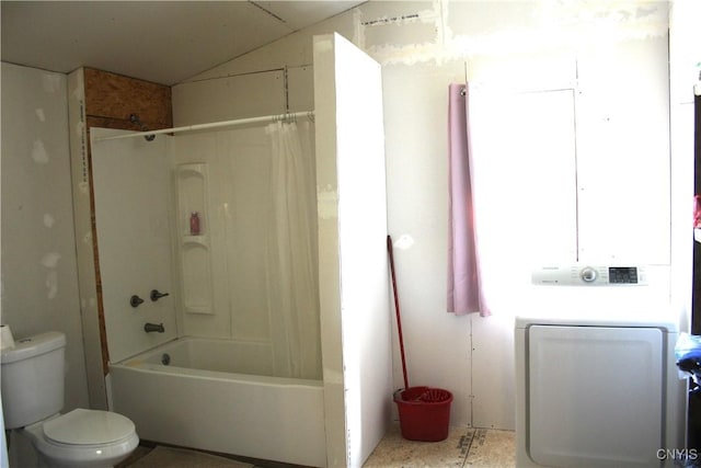 bathroom with toilet, shower / bath combo with shower curtain, and washer / clothes dryer