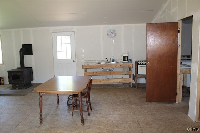 dining room featuring a wood stove