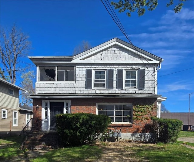 view of front of property featuring brick siding