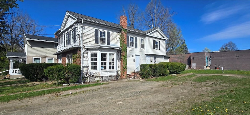 view of home's exterior with a chimney