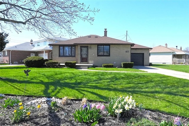 single story home featuring a chimney, a garage, a front yard, and concrete driveway