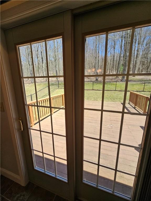 doorway to outside featuring a healthy amount of sunlight