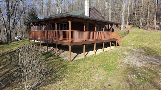 5720 County Route 8, Wheeler, NY 14809 - back of property featuring a view of trees, a chimney, and a lawn