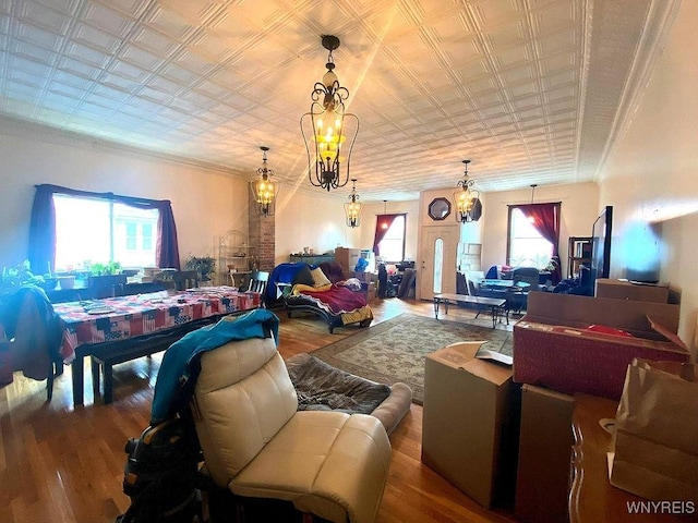 living room featuring an ornate ceiling and wood finished floors