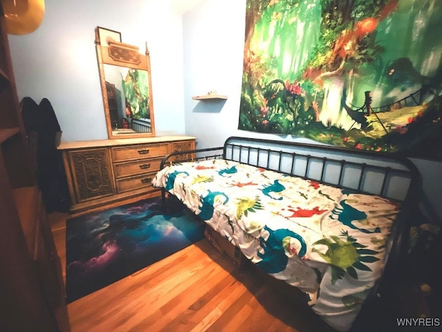 bedroom featuring wood finished floors