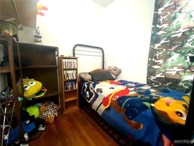 bedroom with wood-type flooring