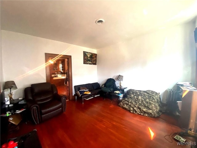 interior space featuring visible vents and wood finished floors