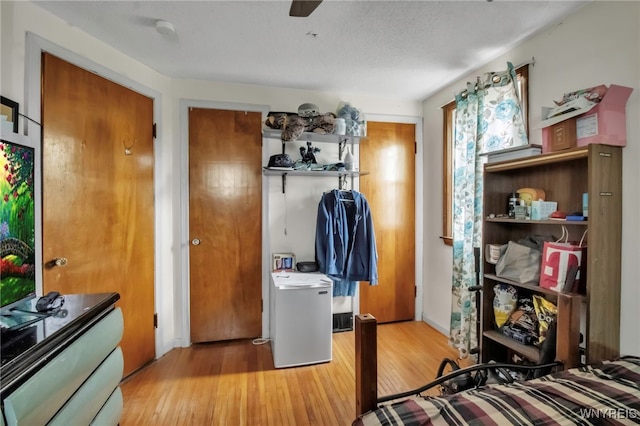bedroom with light wood finished floors