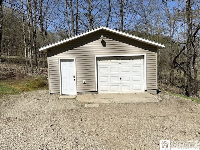 detached garage featuring driveway