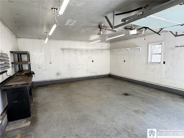 garage featuring a garage door opener and ceiling fan