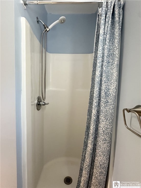full bath featuring a stall shower