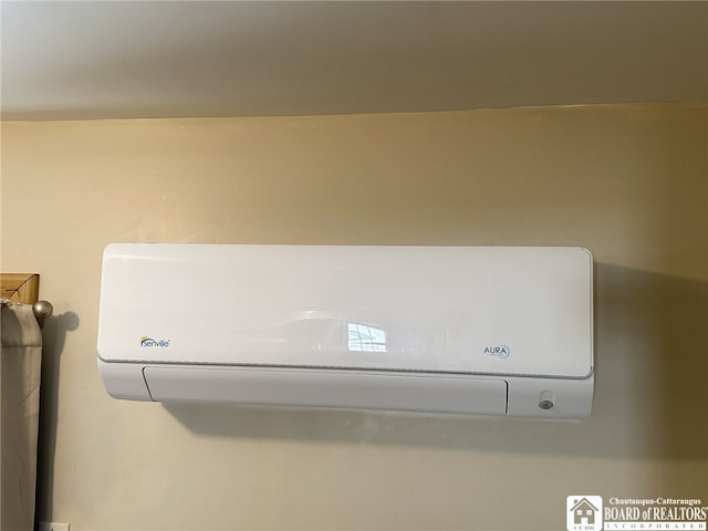details featuring a wall unit AC